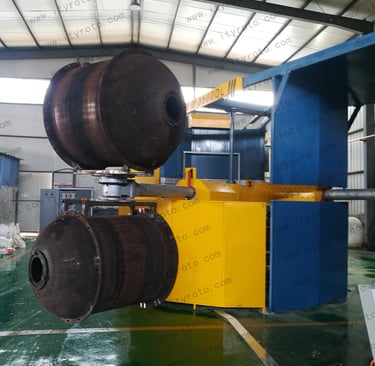Rotomolding machine used for plastic water tank and container production.