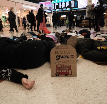 Trans activists lying down during a die-in