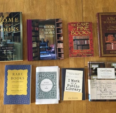a collection of books and bookshelves on a table