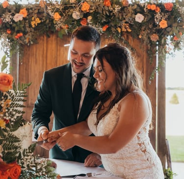 a bride and groom cutting their wedding cake