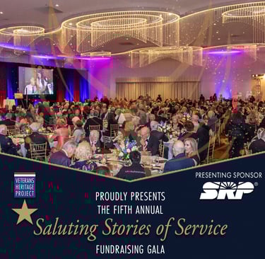 Ballroom full of people acting as a flyer for the Saluting Stories of Service Fundraising Gala