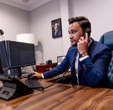 a man in a suit and tie is talking on the phone
