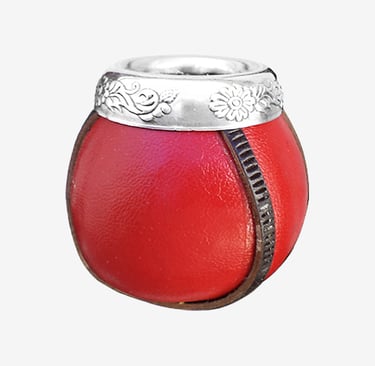 Red leather yerba mate gourd cup with ornate silver rim and floral carvings.