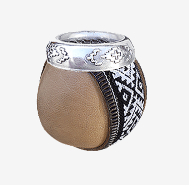 Traditional Argentine mate gourd with leather wrap and engraved silver rim.