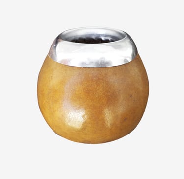 Traditional natural calabash yerba mate gourd with a polished silver rim for drinking tea.