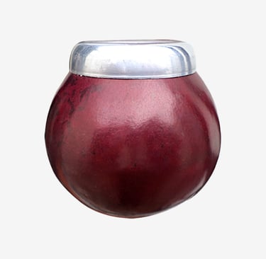 Deep red calabash mate gourd with a polished silver rim used for traditional yerba mate tea.