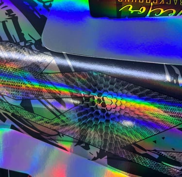 a close up of a colorfully colored skateboard