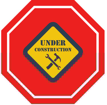 a construction worker's work area with a construction sign