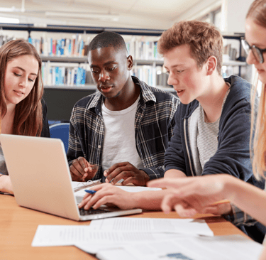 Students collaborating on laptop