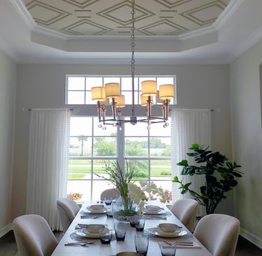 Dining room with gold chandelier lighting
