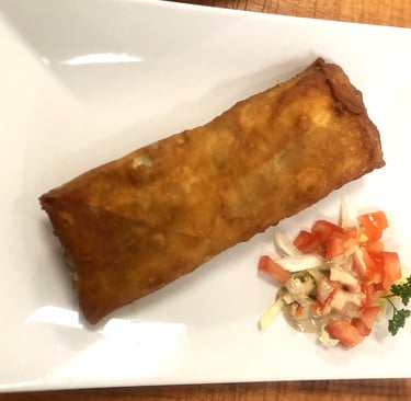 a plate of food on a table with a fork and knife