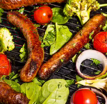 Sustainable plant-based, nutritionally-dense, hypoallergenic protein and fibre sausages with vegetables surrounding