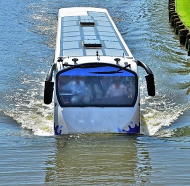 a bus is driving through the water
