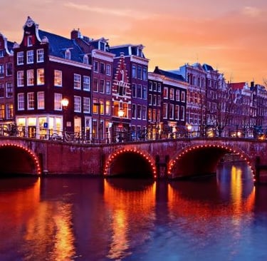 Amsterdam - a bridge over a river with a bridge over it