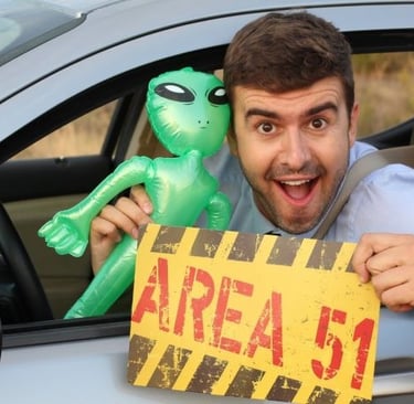 a man holding a sign that says area 51
