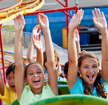 a group of children's hands up in the air