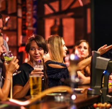 a group of people sitting at a bar