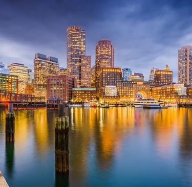 boston city skyline with a river and a bridge