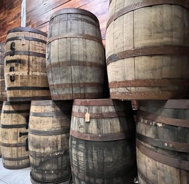 a bunch of barrels of wine barrels stacked on top of each other