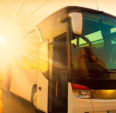 a bus with a person standing in front of a bus