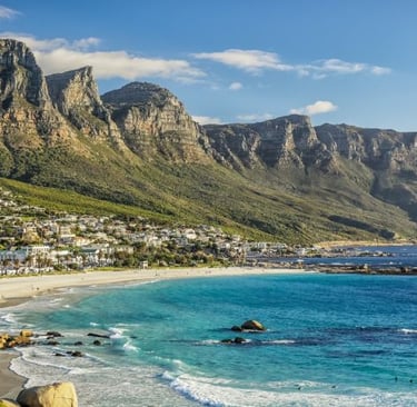 a beach with a mountain in the background