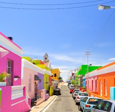 a street scene with cars parked on the side of the road