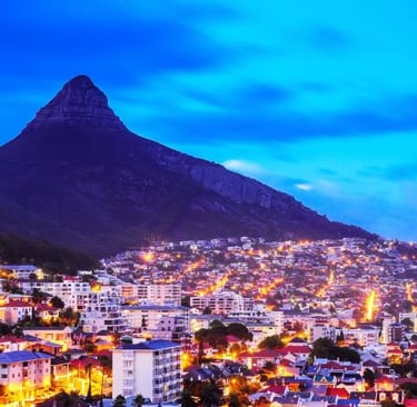 a cityscape of a mountain with a mountain in the background