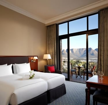 a hotel room with a view of a mountain