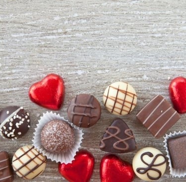 a variety of chocolates and chocolates on a wooden table
