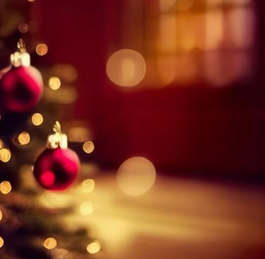 a christmas tree with red ornaments and a christmas tree