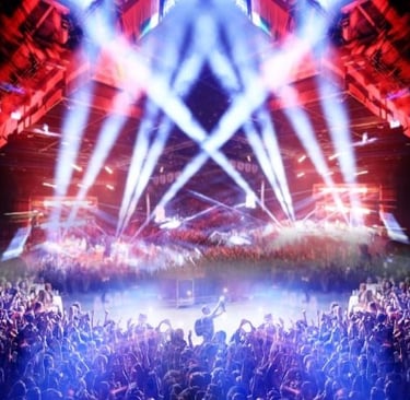 a concert stage with a large crowd of people