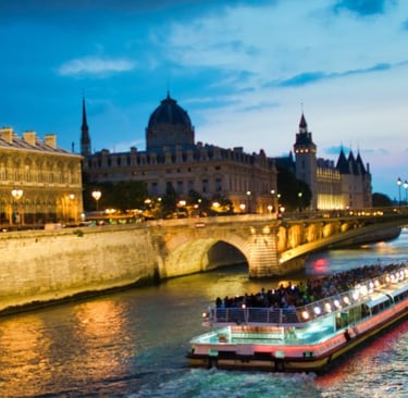 a boat on the river with a bridge in the background