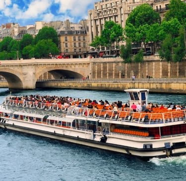 a boat with people on it in the middle of a river