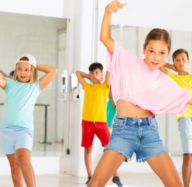 a group of young people dancing in a dance class