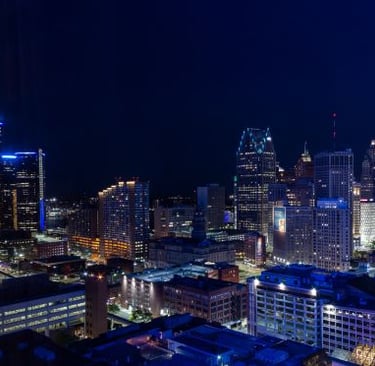 Detroit - a city skyline at night time with a view of the city