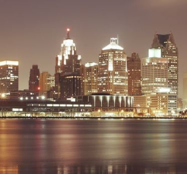 Detroit - a city skyline with a view of a city at night