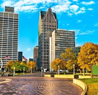detroit - a city street with tall buildings and a clock tower