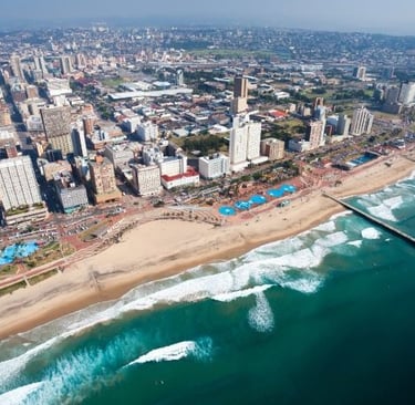 a city skyline view of a beach and Durban city