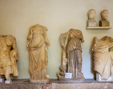 a group of statues of statues of women and men