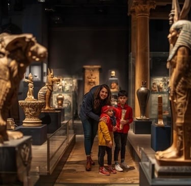 a woman and two children in front of a statue of an egyptian pharaoh