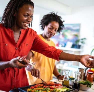 a woman is preparing a meal in a kitchen