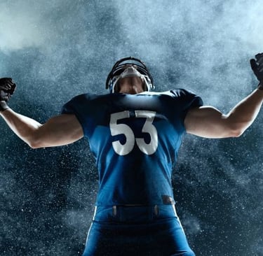 a man in a football uniform holding a football ball