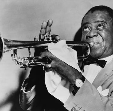 a man in a suit and bow tie playing the trumpet