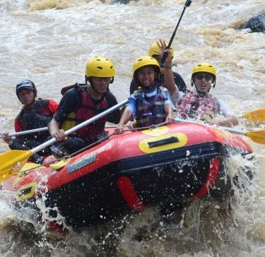 a group of people on a raft raft raft rafting through the water