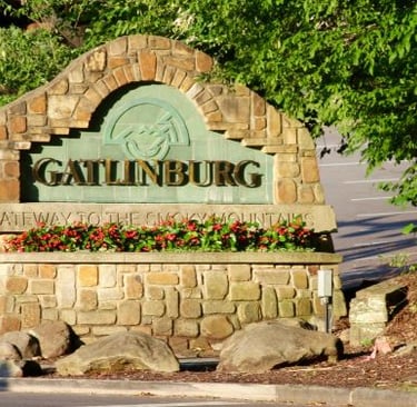 a sign that says gatlinburg, gatling the name of the