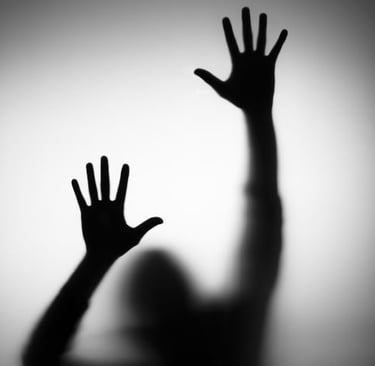 a person's hand is reaching up to a person's hand