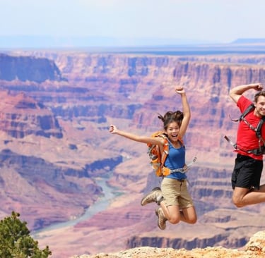 a couple of people jumping in the air