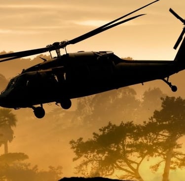 a helicopter flying over a hill with trees in the background