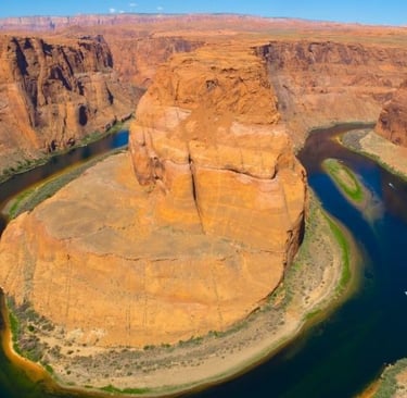 a river running through a canyon in the desert