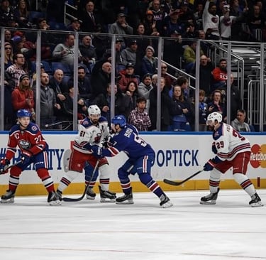 a group of people playing a game of hockey
